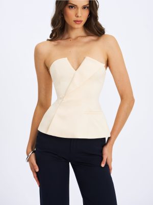 Yani Ivory Asymmetrical Lapel Sleeveless Peplum Top